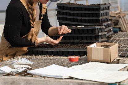 A woman works at a bench